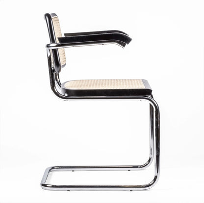 Silla de comedor italiana en ratán con reposabrazos - Cesca