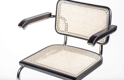 Silla de comedor italiana en ratán con reposabrazos - Cesca